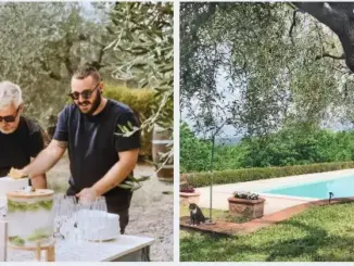 Due persone (gli host) preparano bevande tra gli olivi e piscina immersa nel verde dell’agriturismo in Umbria
